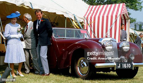 Queen Elizabeth ll chats to actor John Nettles, who plays the part of Jersey detective Bergerac, during her visit to the Channel Islands on May 25,...