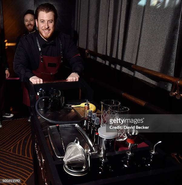 Mixologists Anthony Sazerac and Justin D'Angelo wheel out the table-side mixology cart during the grand opening celebration at Clique Bar & Lounge at...