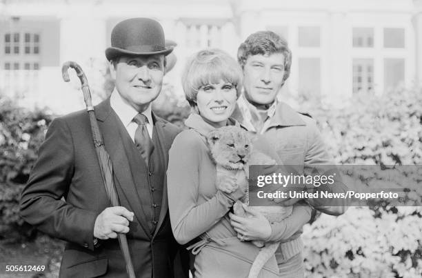 English actors Patrick Macnee, Joanna Lumley and Gareth Hunt posed together at a press reception to launch the television series The New Avengers at...