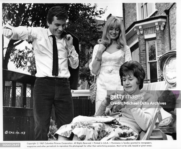 Dudley Moore and Suzy Kendall watch Patricia Routledge in a scene from the movie "30 Is a Dangerous Age, Cynthia", circa 1968.