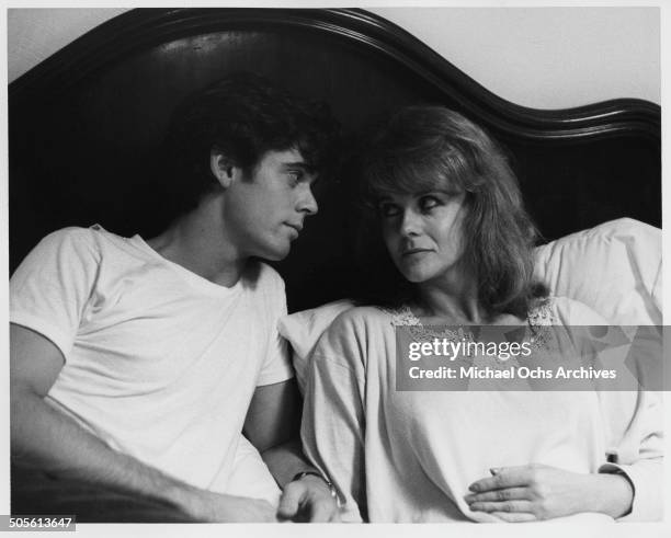 Thomas Howell lays in bed with Ann-Margret in a scene from the movie "A Tiger's Tale" circa 1987.