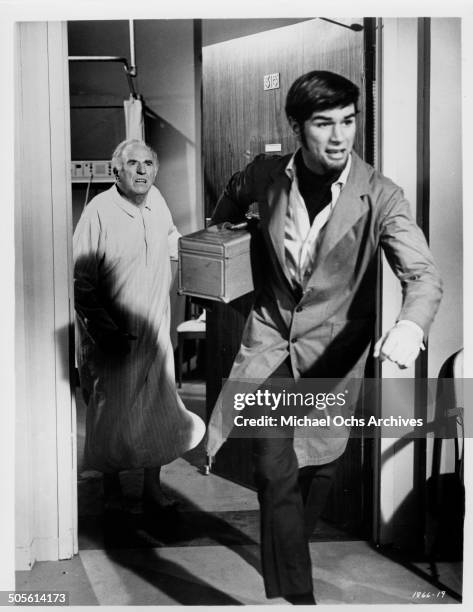 Ed Begley chases Charles Robinson out of his hospital room in a scene from the movie "A Time to Sing", circa 1968.