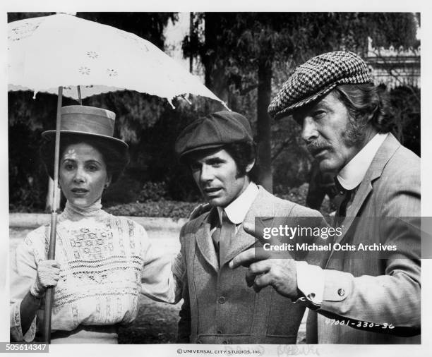 Barbara Parkins, David Birney and Steve Forrest walk in a scene for the TV-Mini Series "Testimony of Two Men", circa 1977.