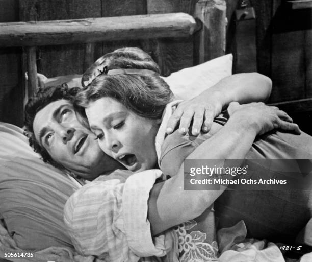 Dean Martin hugs Rosemary Forsyth in a scene from the Universal Studio movie "Texas Across the River", circa 1966.