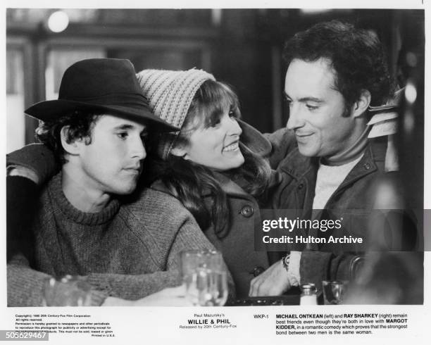 Michael Ontkean, Margot Kidder and Ray Sharkey talk in a bar, in a scene from the 20th Century Fox movie "Willie & Phil" circa 1980.