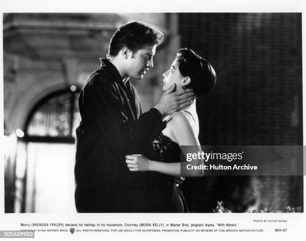 Brendan Fraser and Moira Kelly get close on campus in a scene from the Warner Bros movie "With Honors" circa 1994.