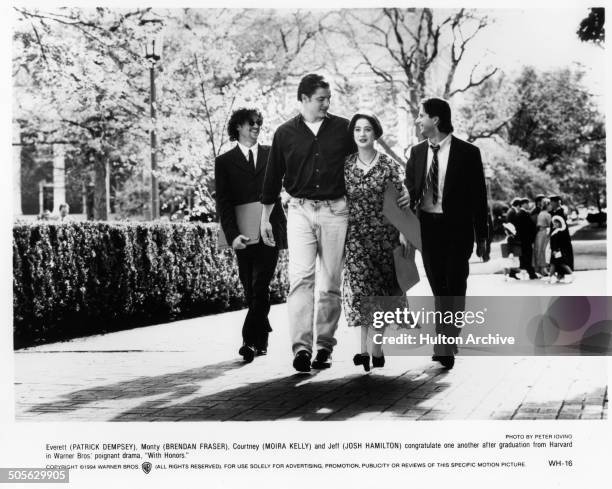 Patrick Dempsey, Brendan Fraser, Moira Kelly and Josh Hamilton walks on campus in a scene from the Warner Bros movie "With Honors" circa 1994.
