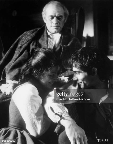 Harry Andrews looks over Anna Calder-Marshall and Timothy Dalton as Heathcliff in the movie "Wuthering Heights" circa 1970.