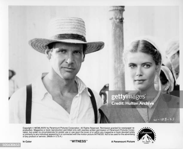 Harrison Ford and Kelly McGillis look on in a scene from the Paramount Pictures movie "Witness" circa 1985.