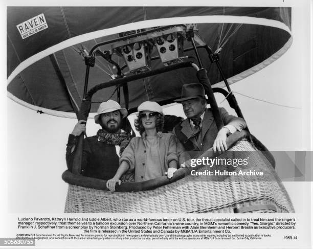 Luciano Pavarotti, Kathryn Harrold and Eddie Albert take a hot air balloon ride in a scene from the movie "Yes, Giorgio" circa 1982.