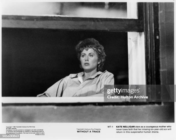 Kate Nelligan looks out a window in a scene in the 20th Century Fox movie "Without a Trace" circa 1983.