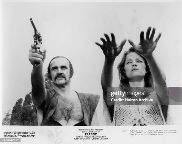 Sean Connery and Charlotte Rampling walk in a scene from the 20th Century Fox movie "Zardoz" circa 1974.