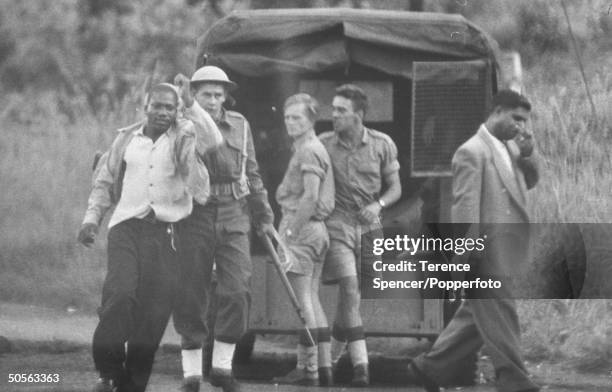 Armed South African police detain a resident during attempts to regain order as protestors from the township of Sharpeville demonstrate against...