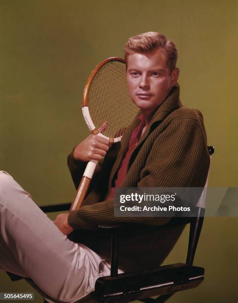 American actor Troy Donahue poses with a tennis racquet, circa 1960.