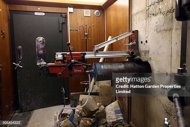 Diamond drill is positioned to drill a hole in the wall used by burglars to access the underground vault of the Hatton Garden Safe Deposit Company...