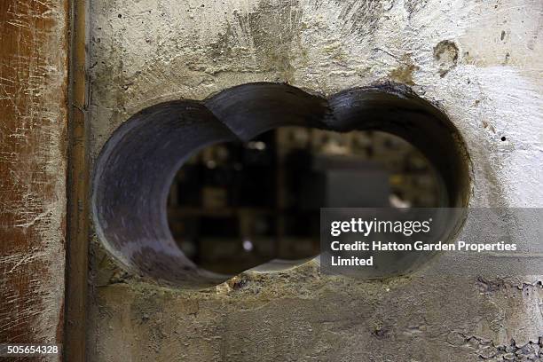 Hole is pictured after having been re-drilled in the wall used by burglars to access the underground vault of the Hatton Garden Safe Deposit Company...