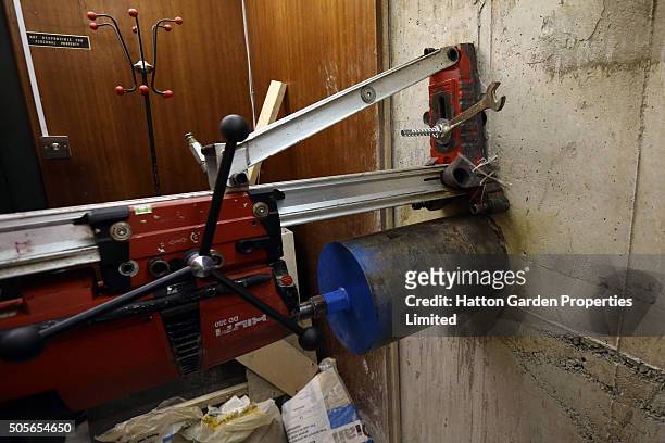 Diamond drill is positioned to drill a hole in the wall used by burglars to access the underground vault of the Hatton Garden Safe Deposit Company...