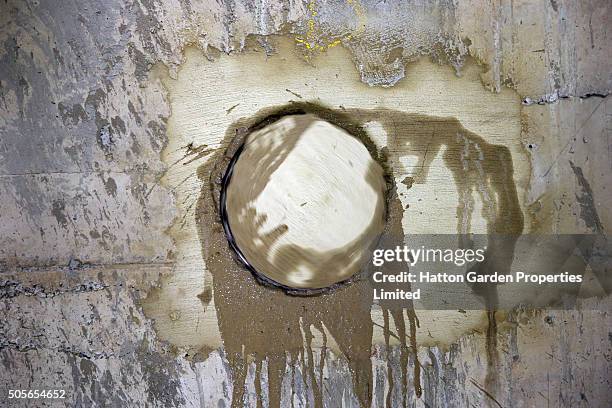 Hole is re-drilled in the wall used by burglars to access the underground vault of the Hatton Garden Safe Deposit Company which was raided in what...