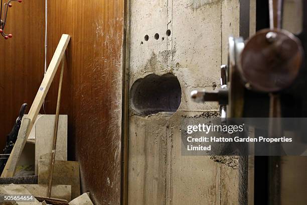 Hole is pictured after having been re-drilled in the wall used by burglars to access the underground vault of the Hatton Garden Safe Deposit Company...