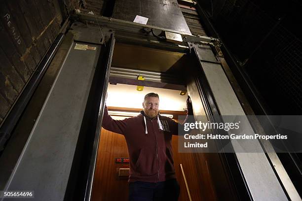 Caretaker looks in the lift shaft used to access the underground vault of the Hatton Garden Safe Deposit Company which was raided in what has been...