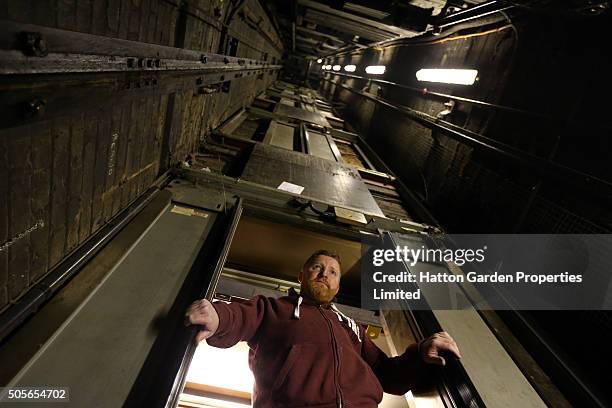 Caretaker looks in the lift shaft used to access the underground vault of the Hatton Garden Safe Deposit Company which was raided in what has been...