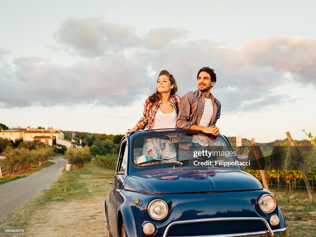 Young Couple Trip With Vintage Car