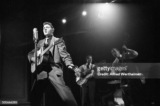 Alfred Wertheimer/MUUS Collection via Getty Images) American musician Elvis Presley performs live on stage at CBS-TV's Studio 50 on the Dorsey...
