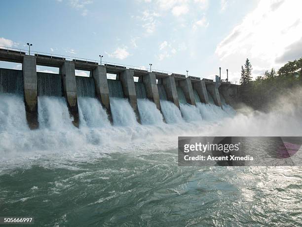 hydroelectric dam during spring runoff, full water - ダム ストックフォトと画像