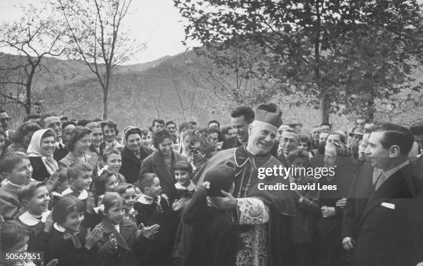 Bishop Francesco Marchesani, during the giving of stock certificates to every gualified resident of the village of Sam Marco.