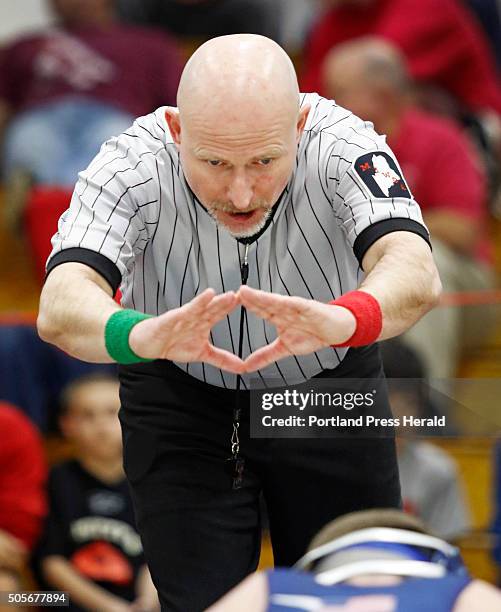 Referee Paul Conner of Biddeford makes a call while officiating at the Spartan Wrestling Tournament.