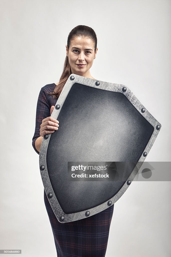 Woman protecting herself with a shield