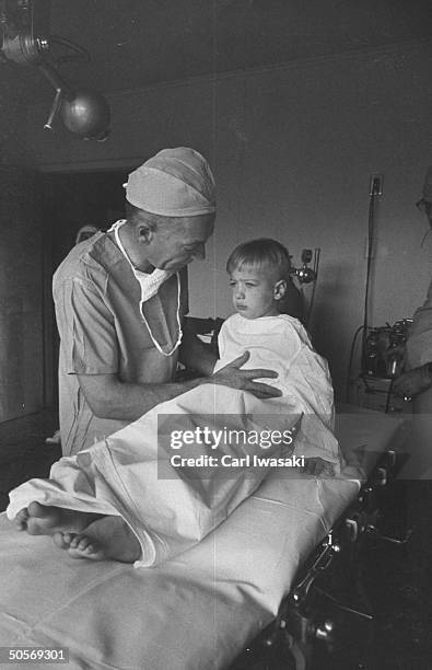 Dr. Ernest Ceriani examining Mark Parie.