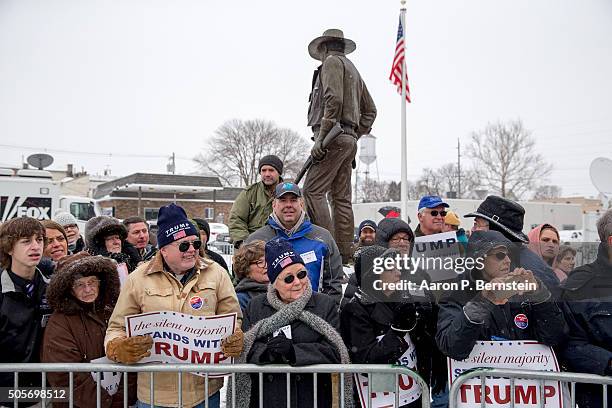 Supporters of Republican presidential candidate Donald Trump wait outside the John Wayne Birthplace Museum on January 19, 2016 in Winterset, Iowa....