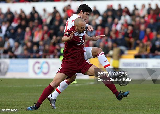 Benfica's midfielder Goncalo Guedes with Oriental Lisboa's defender Joao Pedro in action during the Taca da Liga match between Oriental Lisboa and SL...