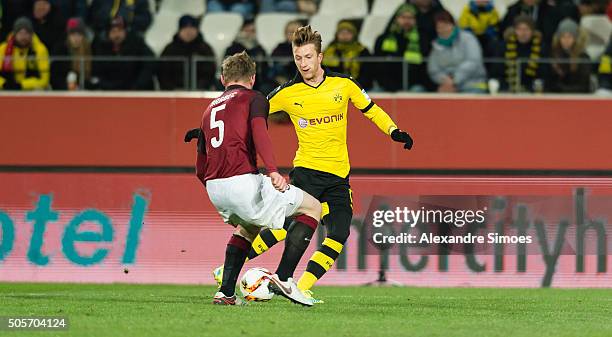 Jakub Brabec of Sparta PragueÊchallenges Marco Reus of Borussia Dortmund during the friendly match between Borussia Dortmund v Sparta Prague on...