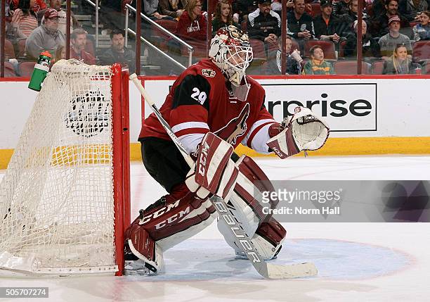 Anders Lindback of the Arizona Coyotes gets ready to make a save against the New Jersey Devils at Gila River Arena on January 16, 2016 in Glendale,...