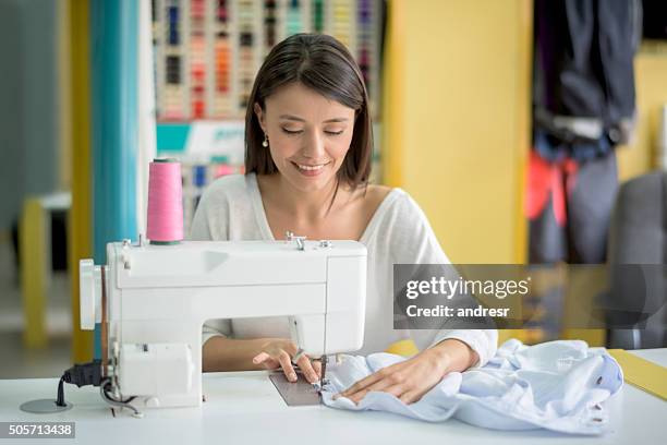 tailor sewing clothes - sewing machine stock pictures, royalty-free photos & images