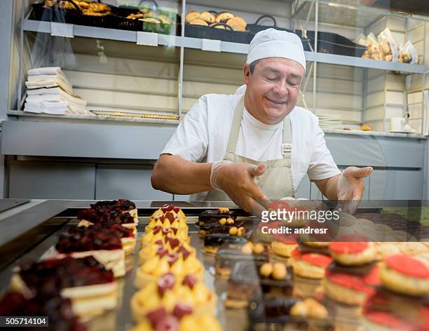 Happy man baking sweet treats