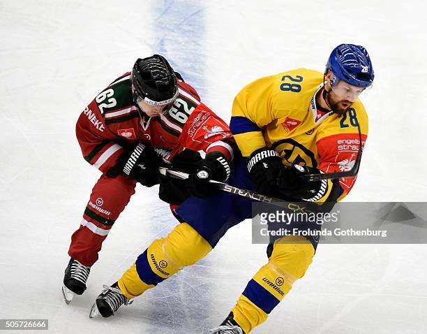 Dick Axelsson of HC Davos and Artturi Lehkonen of HC Davos in action during the Champions Hockey League semi final between Frolunda Gothenburg and HC...