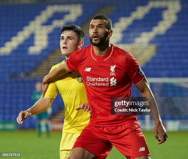 Steven Caulker of Liverpool and Euan Mulhern of Leeds United in action during the Liverpool v Leeds United U21 Premier League Cup game at Prenton...