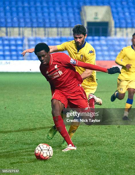 Ovie Ejaria of Liverpool and Alex Purver of Leeds United in action during the Liverpool v Leeds United U21 Premier League Cup game at Prenton Park on...