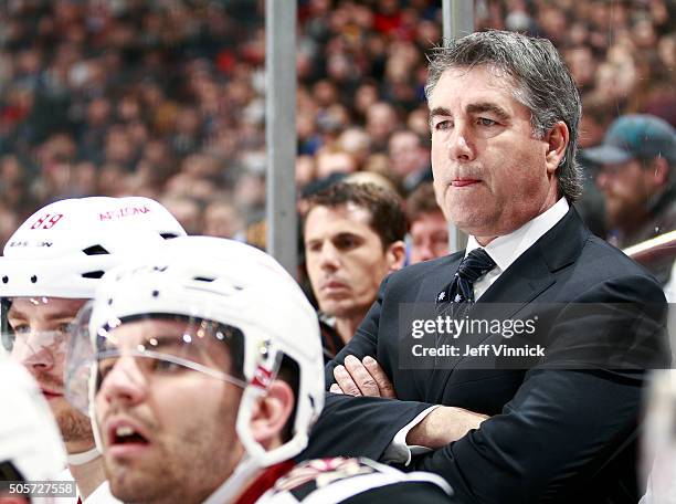 Head coach Dave Tippett of the Arizona Coyotes looks on from the bench during their NHL game against the Vancouver Canucks at Rogers Arena January 4,...