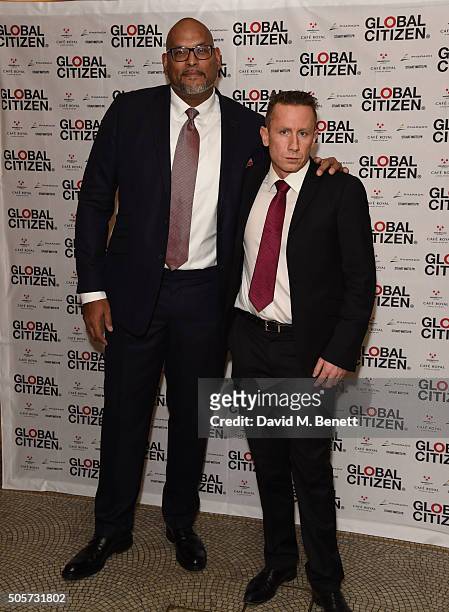 John Amaechi and Byron Lewis attend the Global Citizen 2016 VIP Dinner at Cafe Royal on January 19, 2016 in London, England.