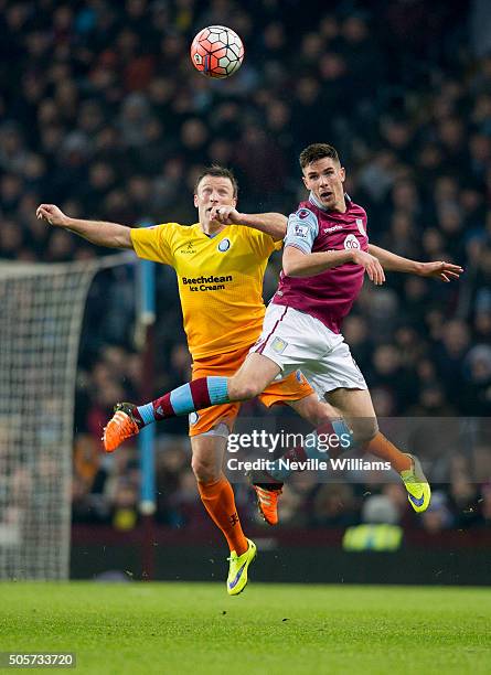 Ciaran Clark of Aston Villa is challenged by Gary Thompson of Wycombe Wanderers during the FA Cup Third Round Relay match between Aston Villa and...