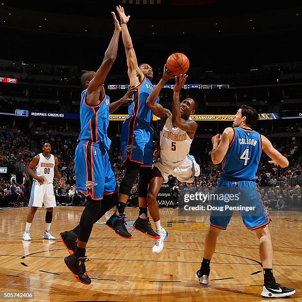 Will Barton of the Denver Nuggets tries to get off a shot against the defense of Kevin Durant, Russell Westbrook and Nick Collison of the Oklahoma...