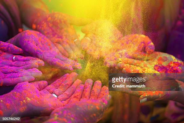 hands and colorful powders of the holi festival - culturen stockfoto's en -beelden