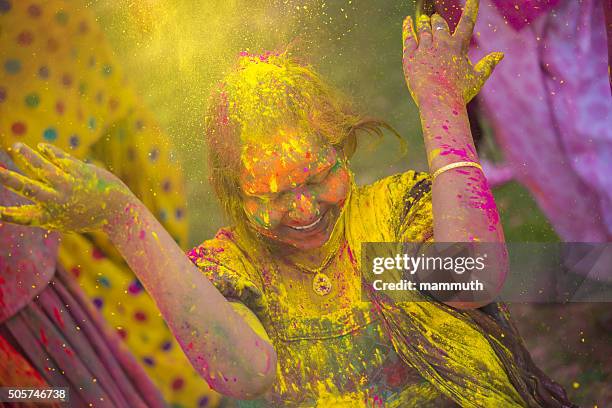 young indian girl celebrating holi festival in india - throwing paint stock pictures, royalty-free photos & images