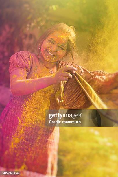 young indian girl celebrating holi festival in india - traditional dancing stock pictures, royalty-free photos & images