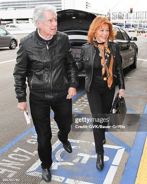 Regis Philbin and Joy Philbin are seen at LAX on January 19, 2016 in Los Angeles, California.