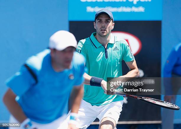Jonathan Erlich of Israel and Colin Fleming of Great Britain compete in their first round match against Robin Haase of the Netherlands and Fernando...